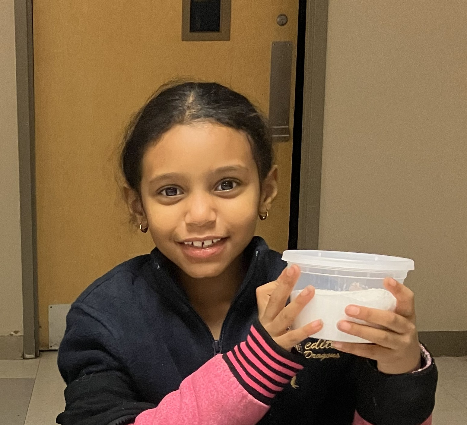 Student creating slime at STEM crafts activity