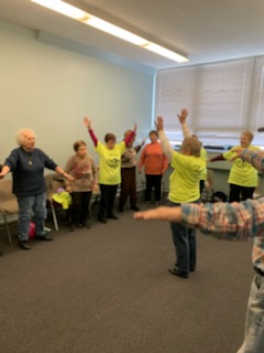 Seniors participating in group exercise and wellness class